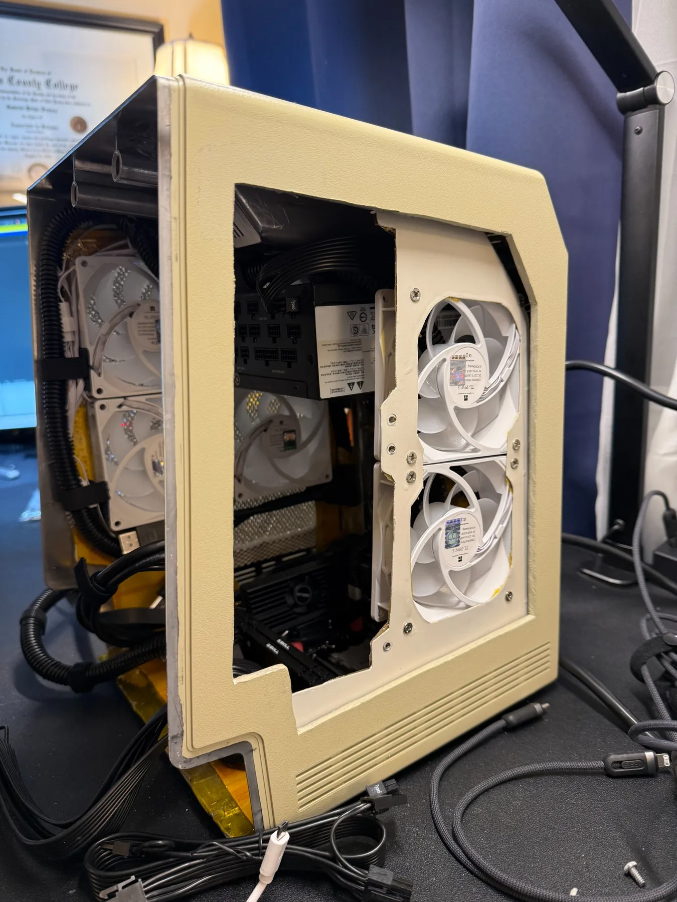 Side view of custom-fabricated cooling and components inside the Macintosh Plus case