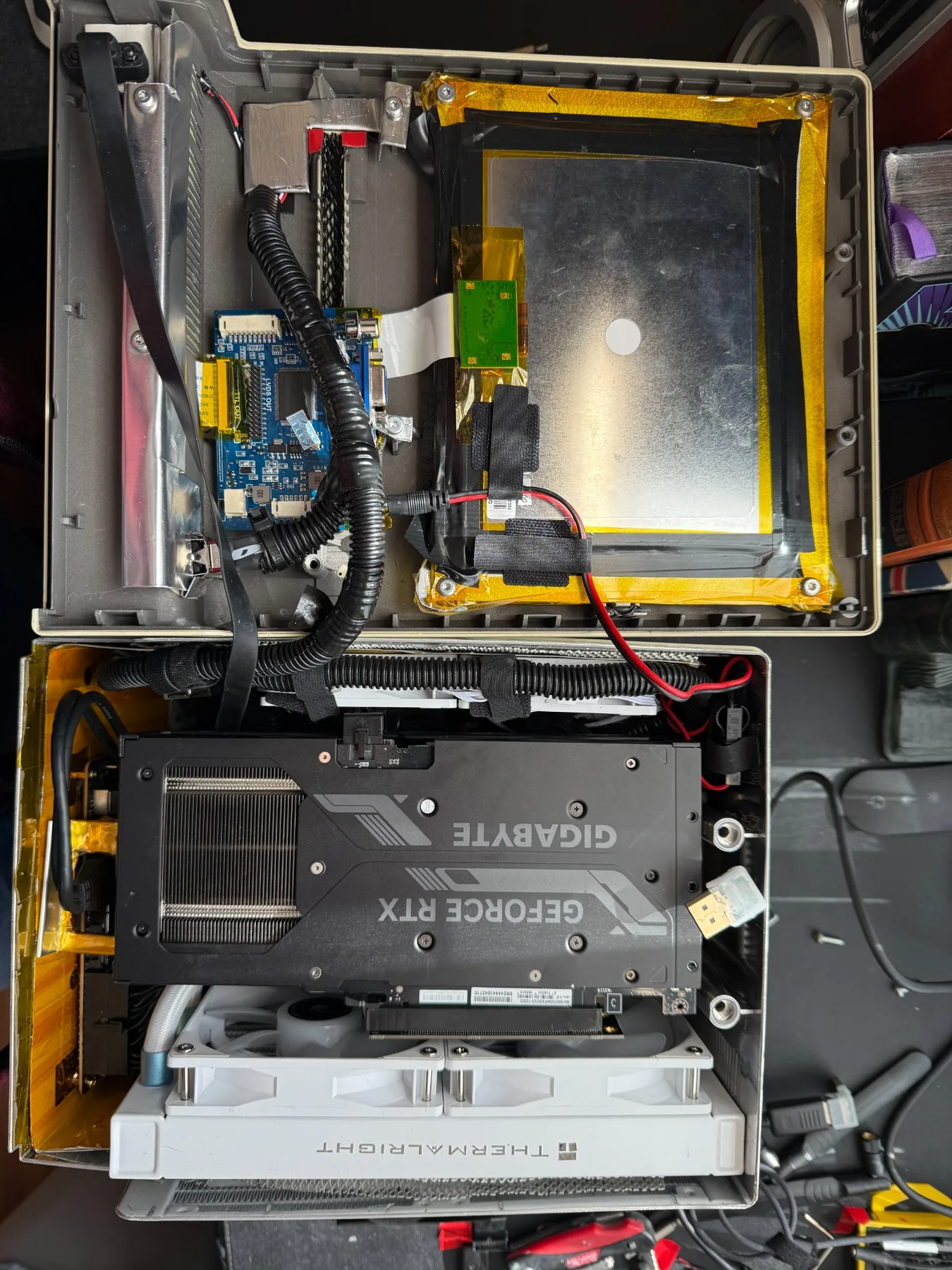 Internal view of the Macintosh Plus sleeper PC showing the graphics card and custom cooling