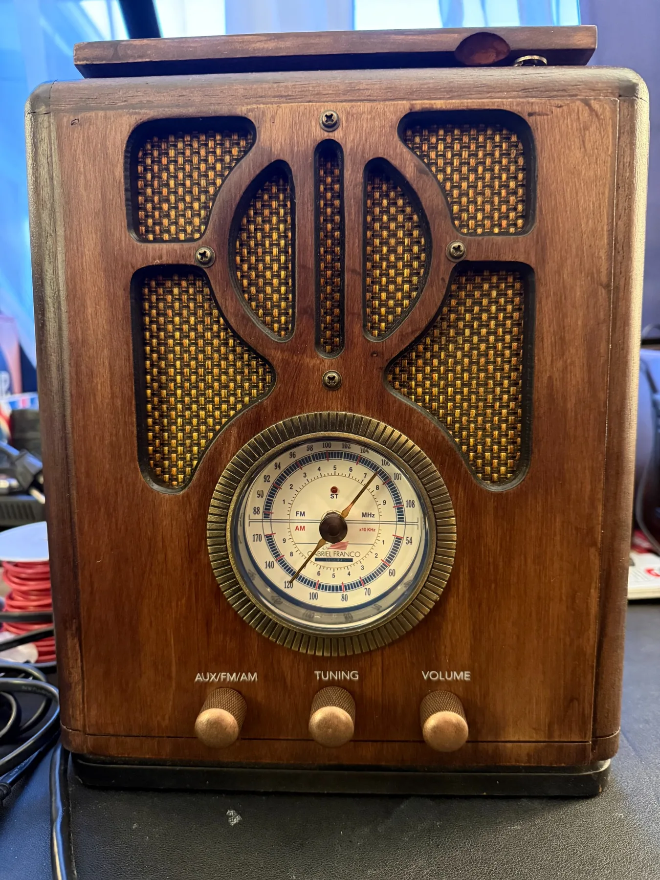 Refinished vintage radio cabinet with restored dial and controls