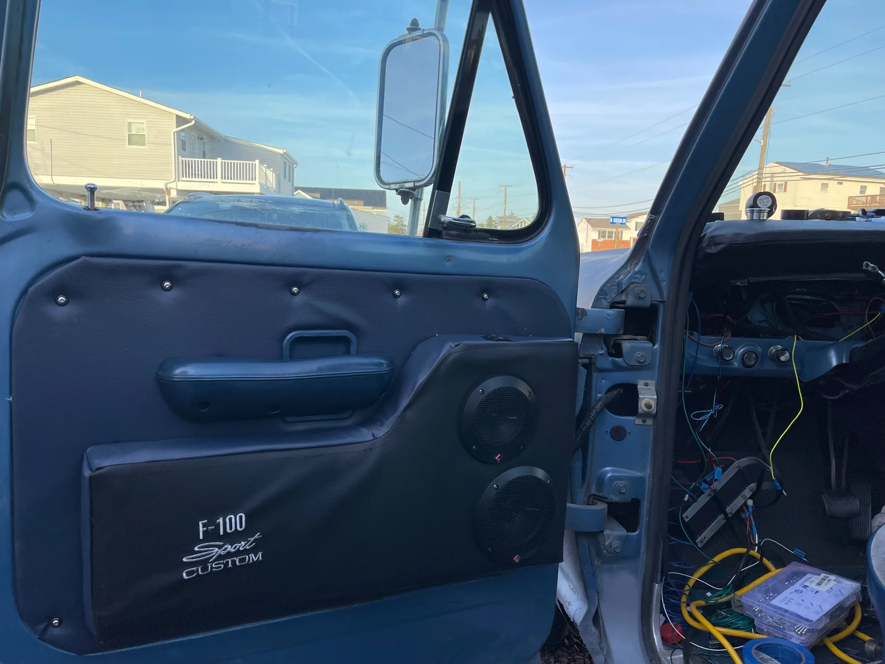 Custom fabricated interior door panel with integrated speakers in the Ford F-100