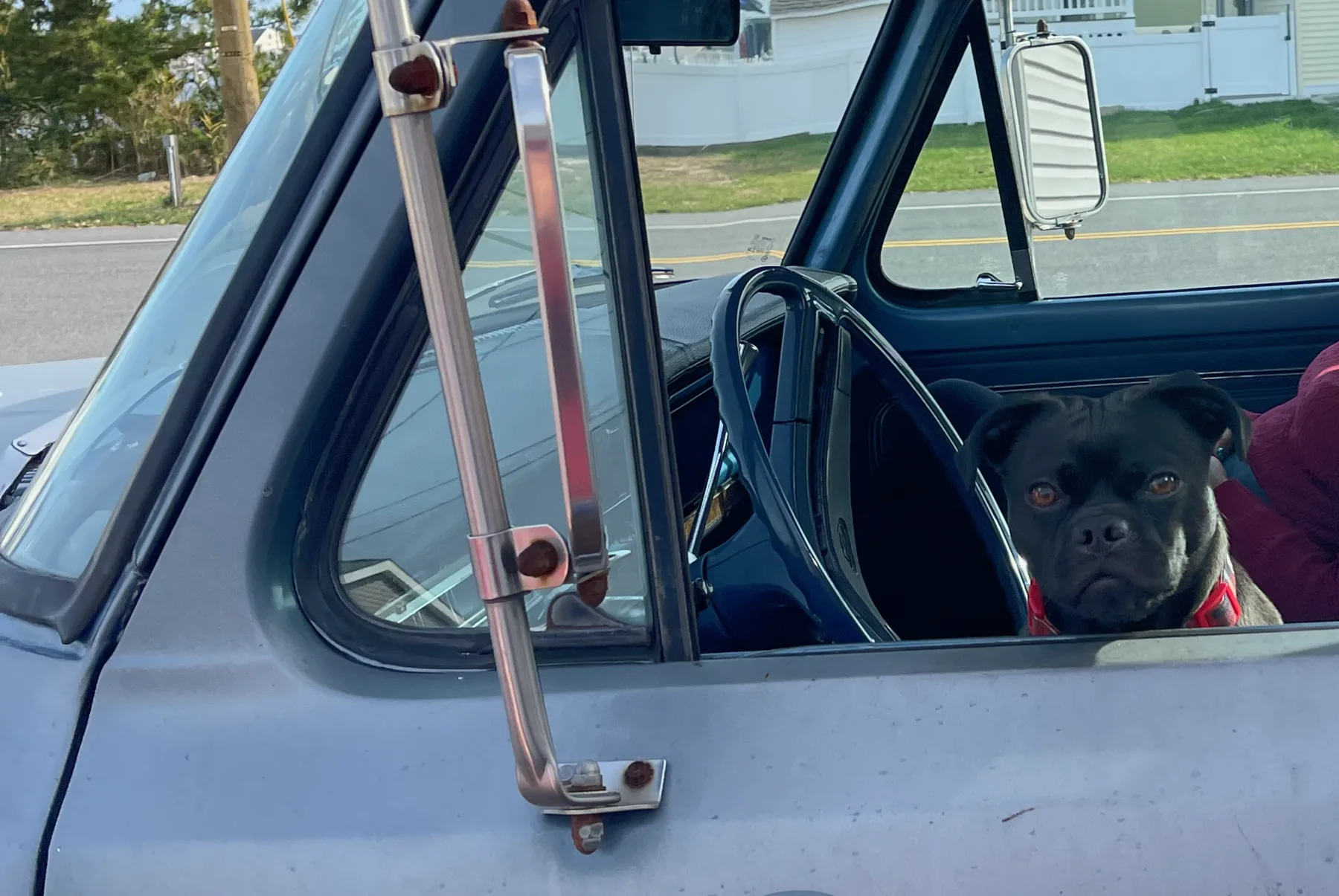 Russell sitting in the driver's seat of the Ford F-100