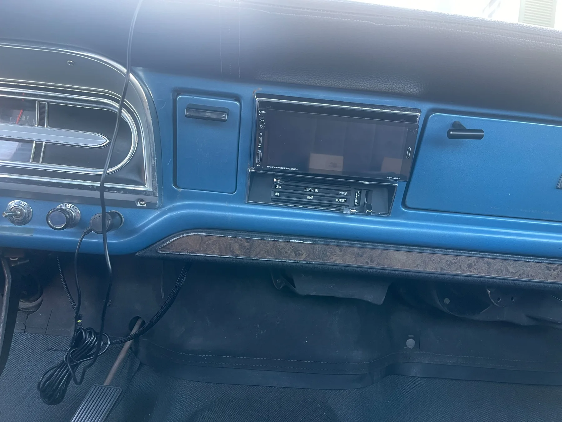 Custom electronics and audio integrated into the dashboard of the Ford F-100